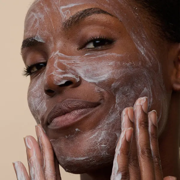 In-treatment still: cleanser massaged onto the face