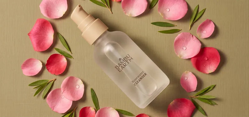 Rosewater Cleanser bottle with rose petals